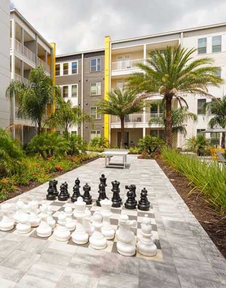 A hotel named "Hilton" with a fountain in front.