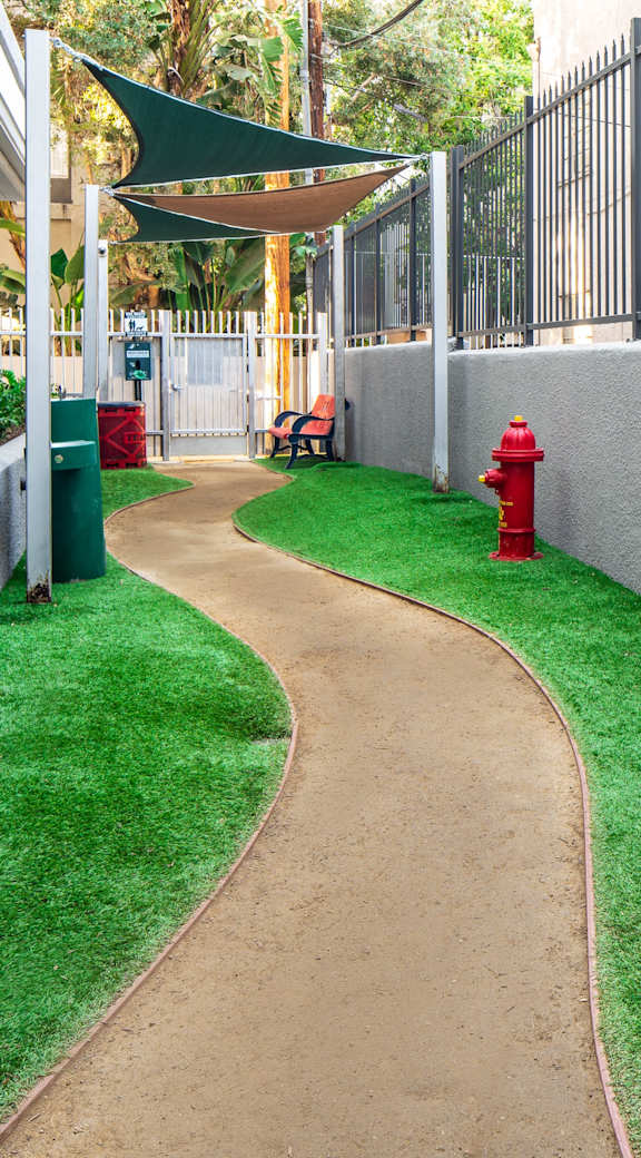 Gated Dog Park With Lush Green Grass at The Preston Miracle Mile Apartments, Los Angeles, 90036