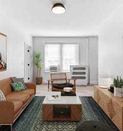 a living room with a couch and a table and a kitchen