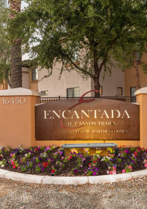 a view of the sign at the entrance to the encantada saguaro national park