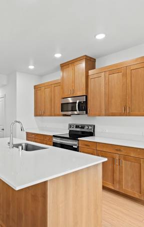 a kitchen with a large island in the middle of it