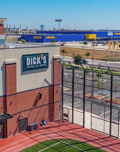 A Dick's Sporting Goods store is shown from a high angle.