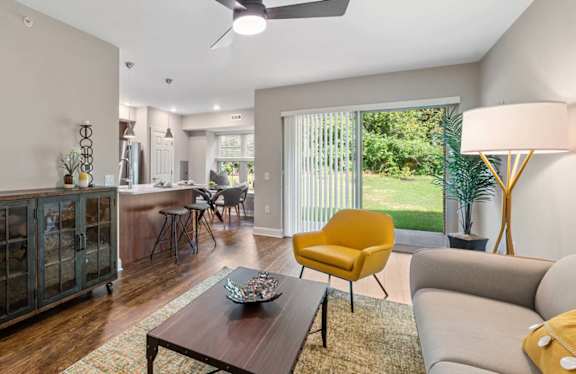 A modern kitchen with a wooden island and stainless steel appliances.