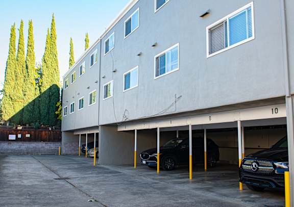 A parking garage with cars parked in it.