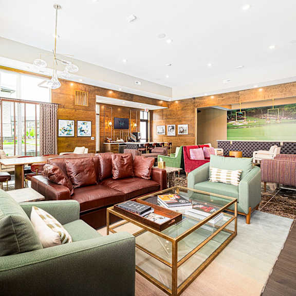 A living room with a green couch and a coffee table.