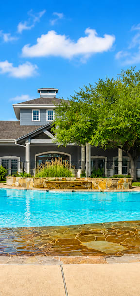 A house with a pool in the backyard.