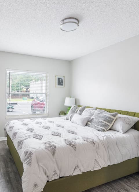 Bedroom with a bed and a window, Rolling Hills Apartments
