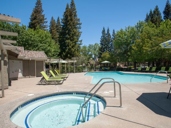 spa and pool area with lounge chairs at Zinfandel Village Apartments, Rancho Cordova, California 95670