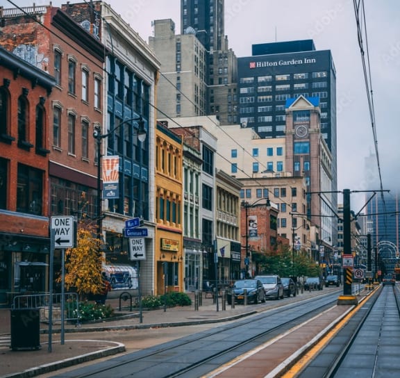 a city street in a city with tall buildings  at Nineteen North, Buffalo, New York