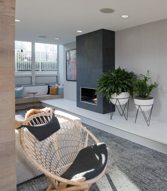 a living room with a chair and a fireplace