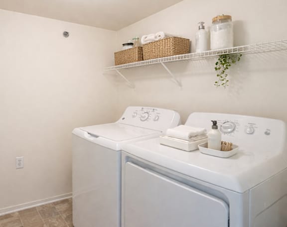 A laundry room with a washer and dryer.