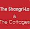 A red sign with white text that says "The Shangri-La & The Cottages".