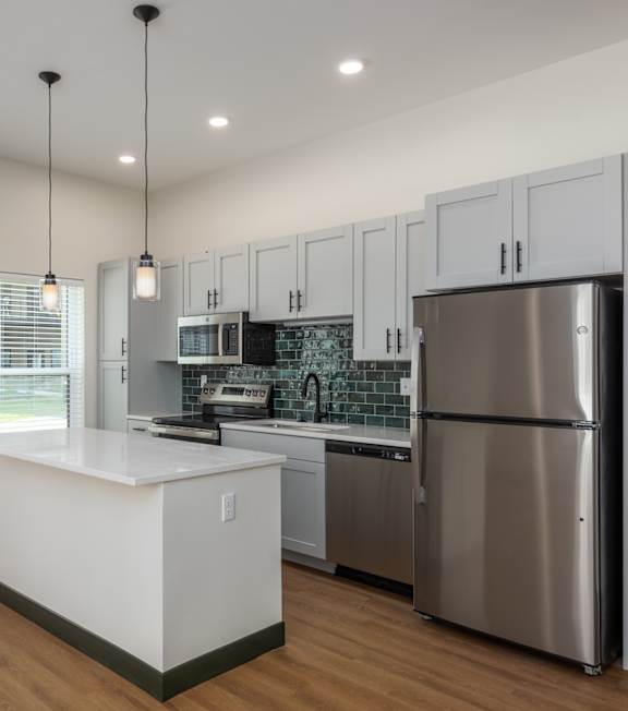 Kitchen with stainless steel refrigerator at The Rail, Missouri, 63110
