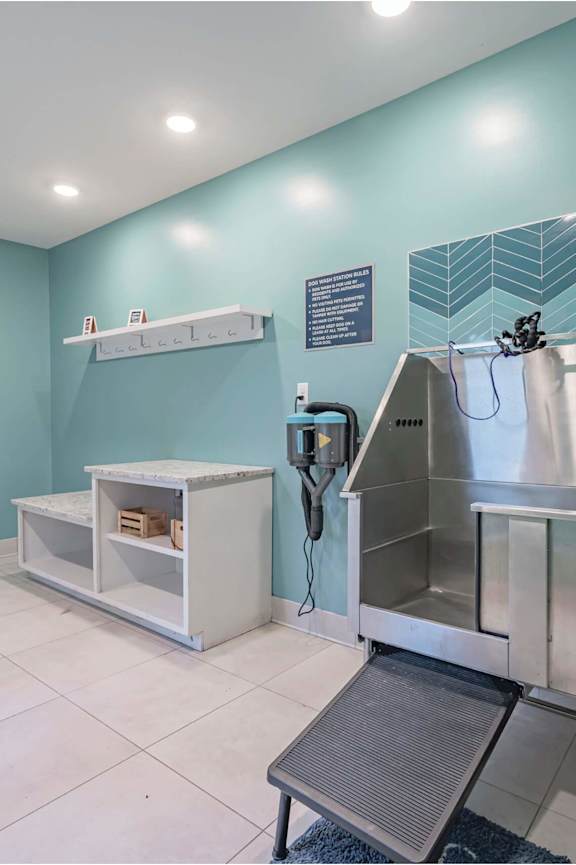 A kitchen with a stainless steel sink and a white counter at Waterleaf at Neely Ferry Apartments, Simpsonville, SC 29680