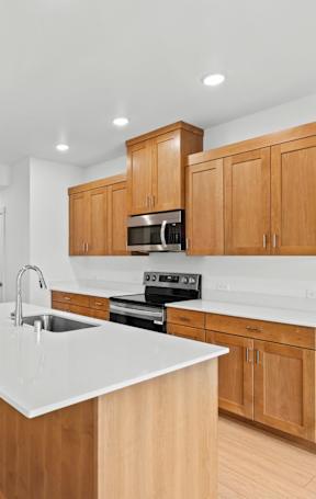 a kitchen with a large island in the middle of it