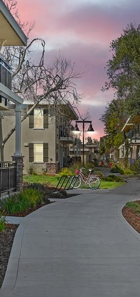 Vines surrounding balcony of apartment at dusk, Parkside Apartments, Davis, California, 95616