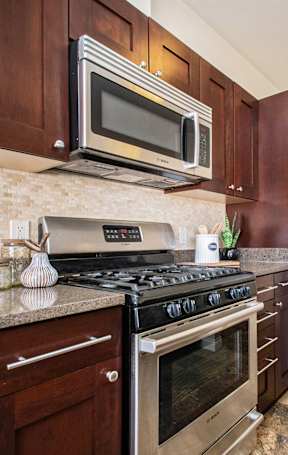 a dining room with a table and chairs at The Residences at Toscana Park, Granger, Indiana