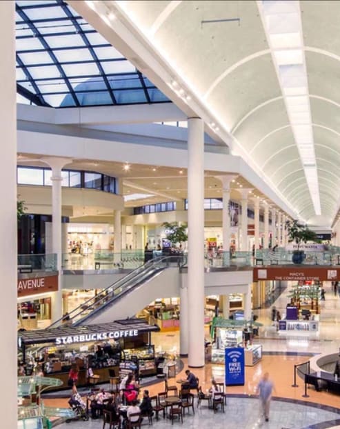 a view of a large shopping mall with people in it
