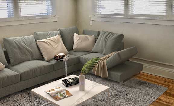 a living room with a couch and coffee table