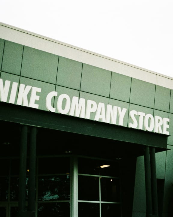 the nike company store sign on the side of a building