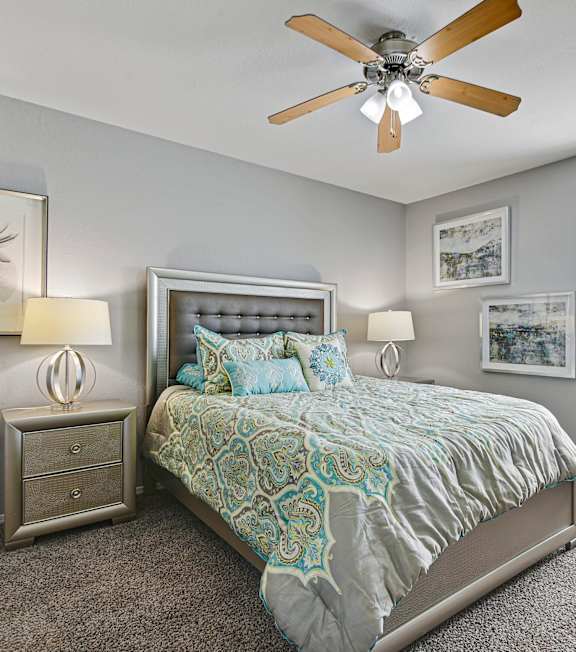 photo of staged bedroom with bright walls and plush carpet