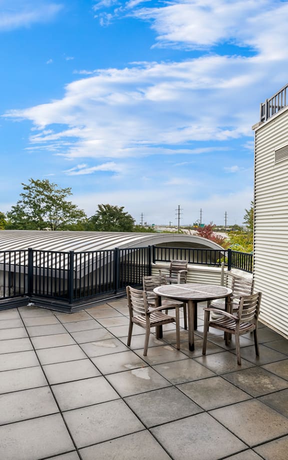 an outdoor seating area on a patio at Tremont Pointe apartments and townhomes in Cleveland, OH