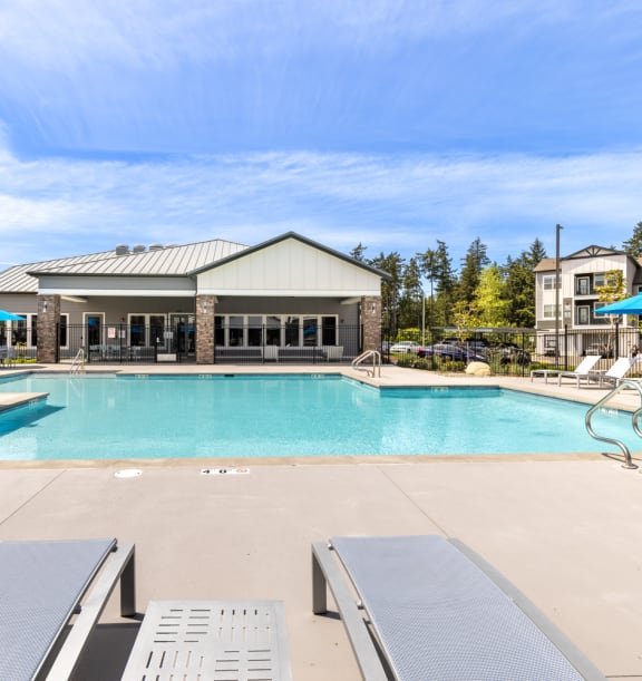 Solace Rainier Ridge Apartments Pool Area and Lounge Chairs