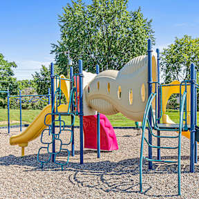 a playground with a slide and other play equipment