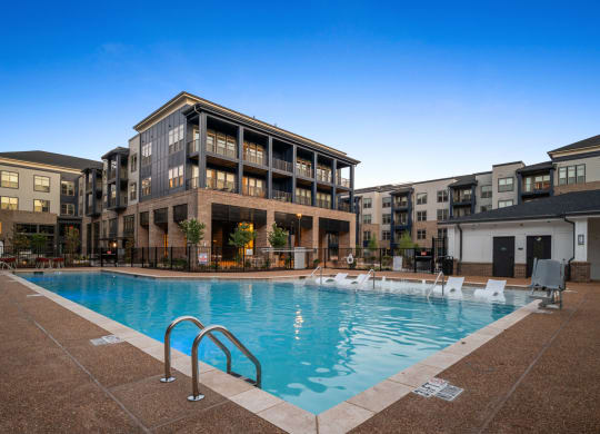 a swimming pool in front of an apartment building at Preston Ridge, Cary, NC, 27513