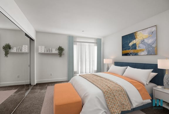 a bedroom with an orange and white bed and a window