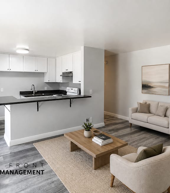 A modern living room with a dining area and a kitchen in the background.