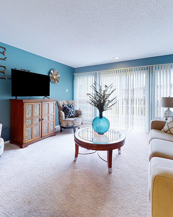 a living room with a couch and a tv