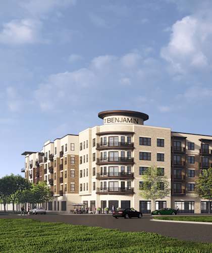 A large apartment building with the name "BENJAMIN" on the top.