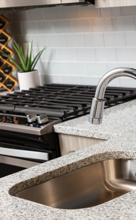 a kitchen with a stove and a sink