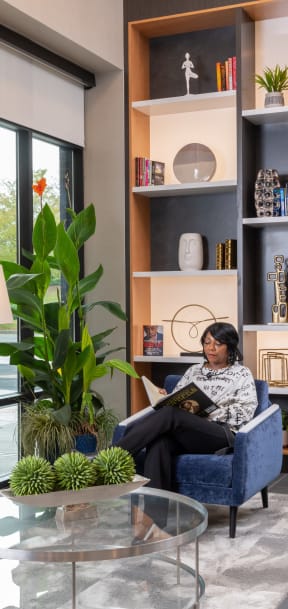 Woman Reading Book in Zen Clubhouse