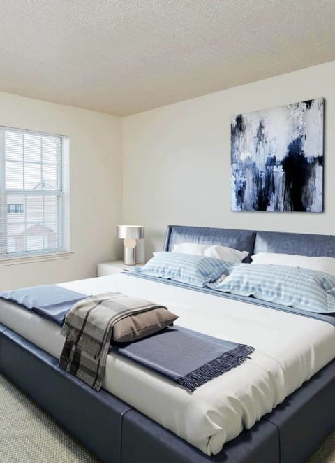 a bedroom with a bed and a window at The Bluffs at Cherry Hills, Nebraska, 68122