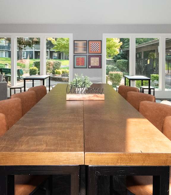 Crown Court Apartments clubhouse gathering table and decor
