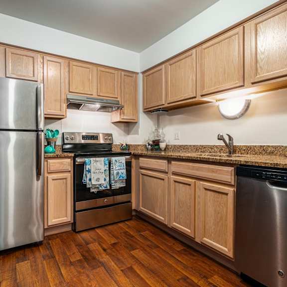 a rendering of a kitchen and dining room in an apartment