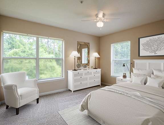 a white bedroom with a large bed and a white dresser