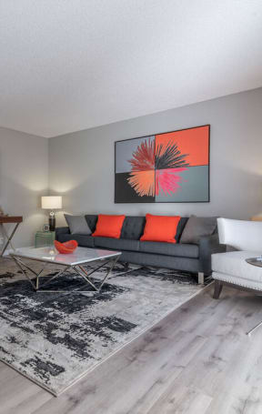 a living room with a couch and a tableat Sunnyvale Crossings Apartments, LLC, California