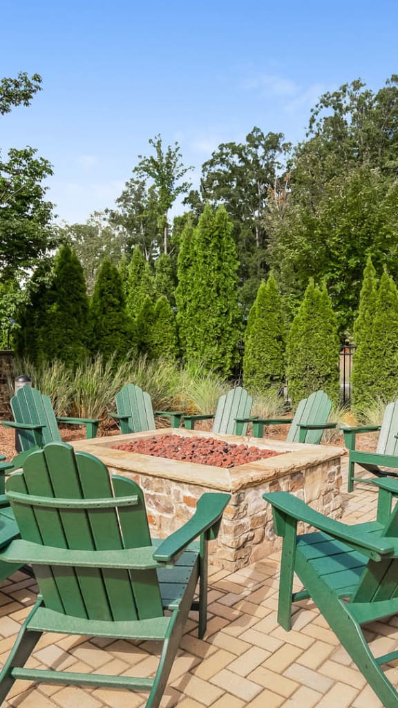 firepit with green chairs