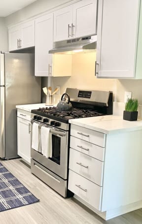 a kitchen with stainless steel appliances and a counter top at BLVD Apartments LLC, California, 91356