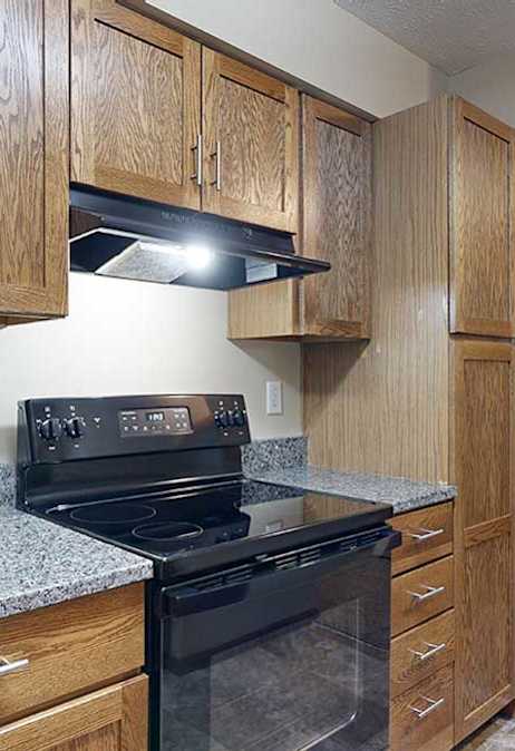 Updated apartment kitchen featuring oven, burners, and counter space.