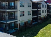Thumbnail 20 of 21 - an exterior view of a building with fenced yards  at Brooklyn West, Missoula, MT, 59808