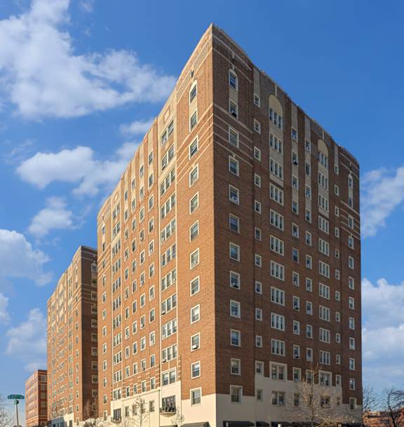 a rendering of an apartment building on a city street