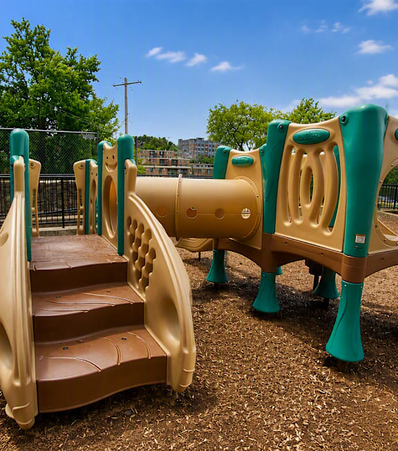 A playground with a slide and steps.
