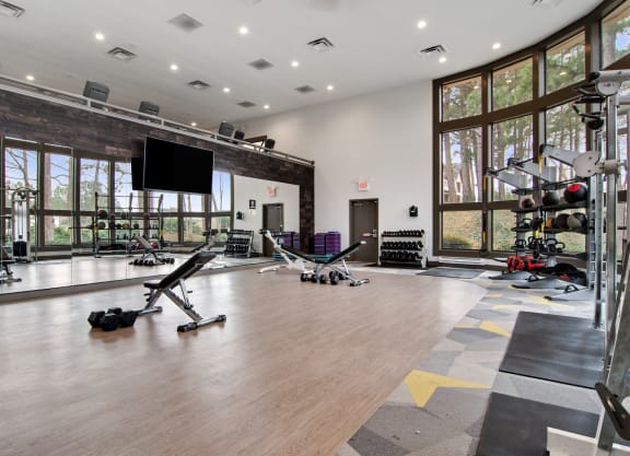 Fitness Center with Free Weights at Duluth Apartments Near Berkeley Hills Country Club