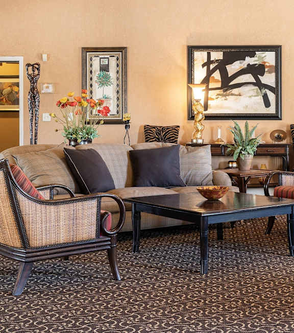 A spacious and inviting clubhouse living area with warm lighting.