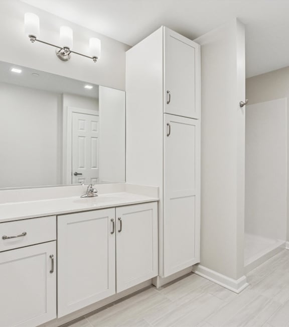 A white bathroom with a sink at Roosevelt Commons Apartments, Philadelphia, 19152