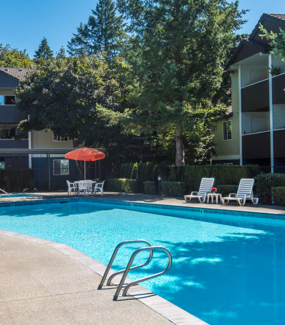 Hathaway Court pool, lounge chairs, tables and umbrellas